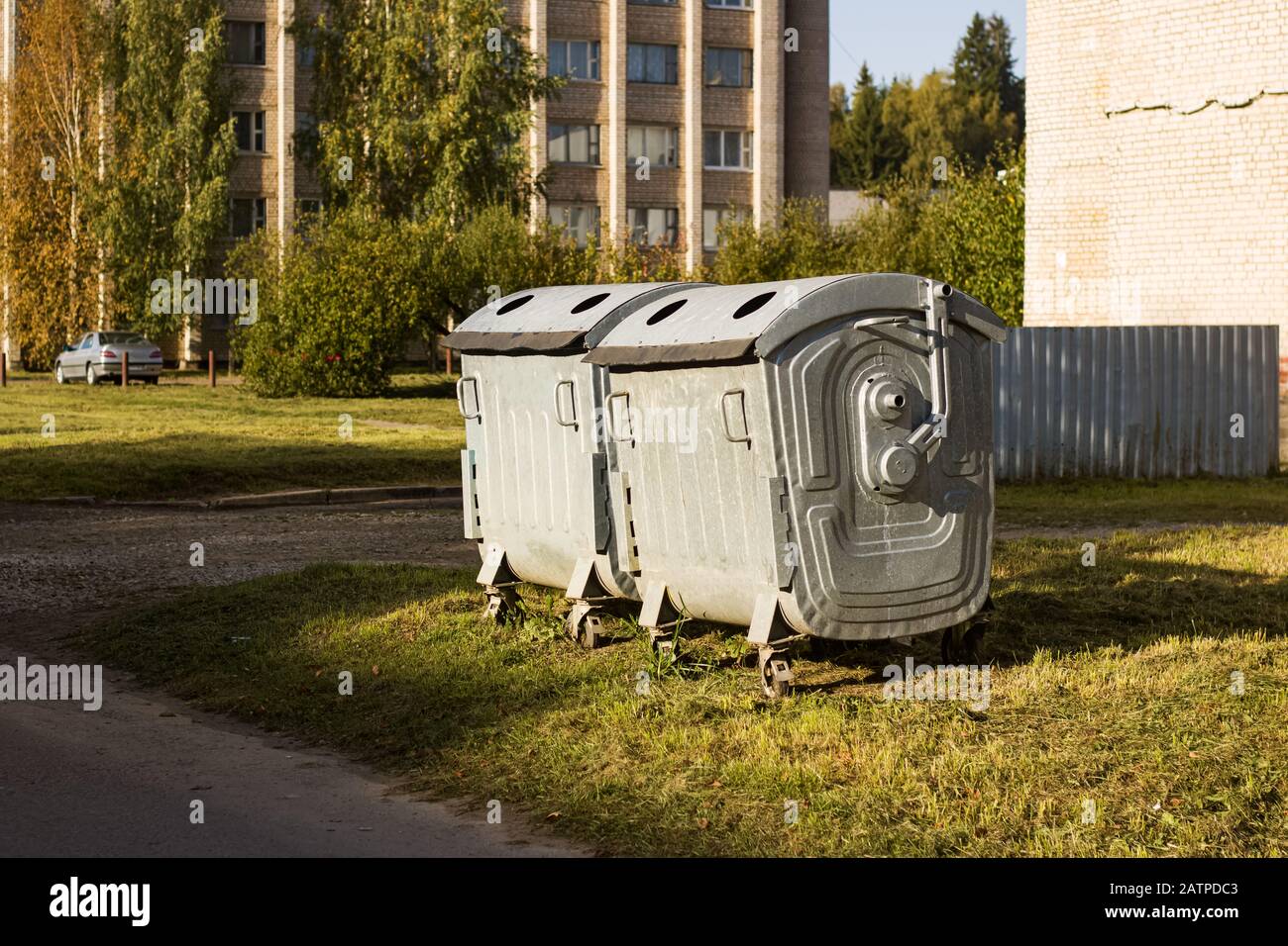 Two large metal containers on the lawn Stock Photo Alamy