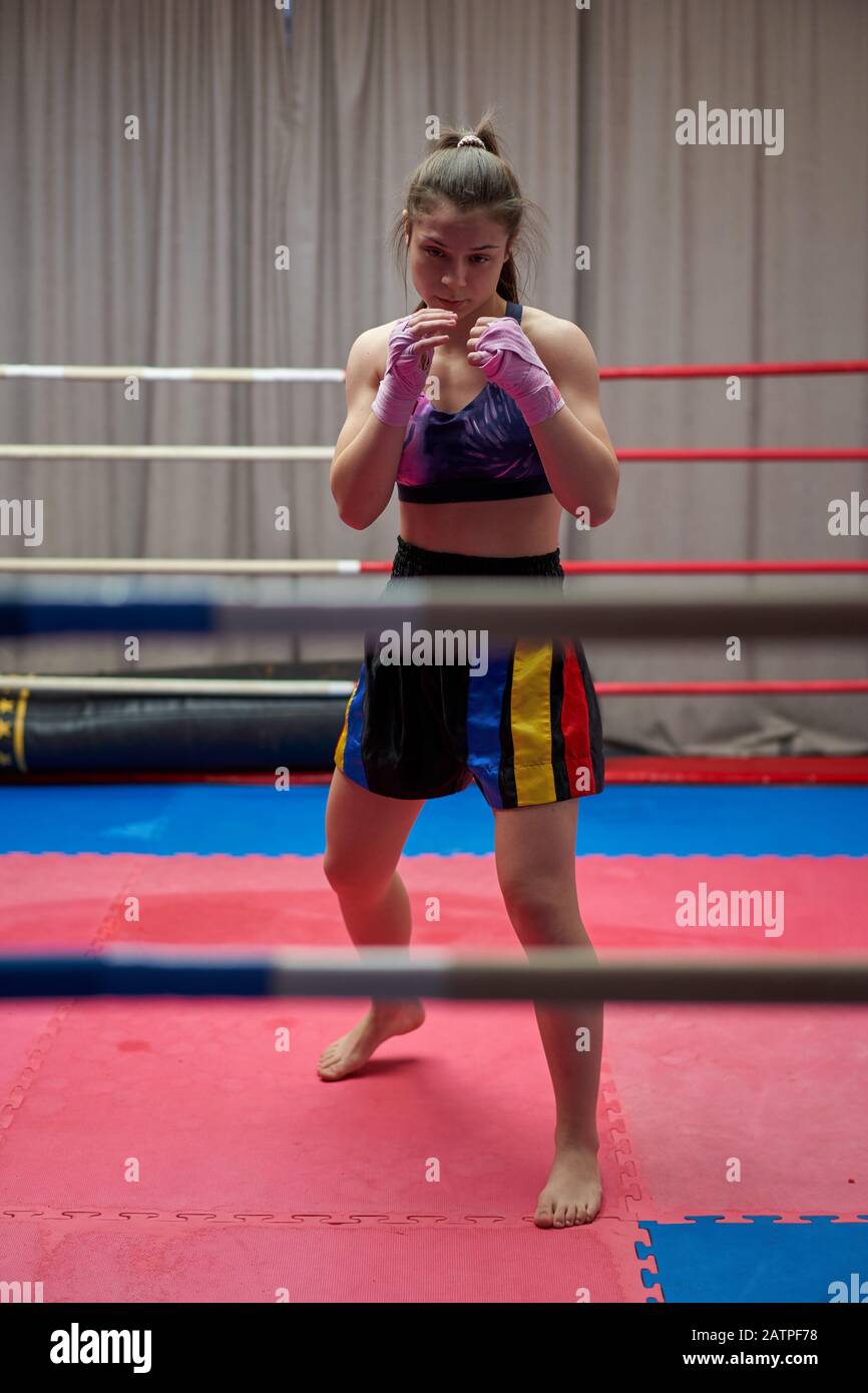 Kickboxing girl doing shadow boxing drill Stock Photo - Alamy