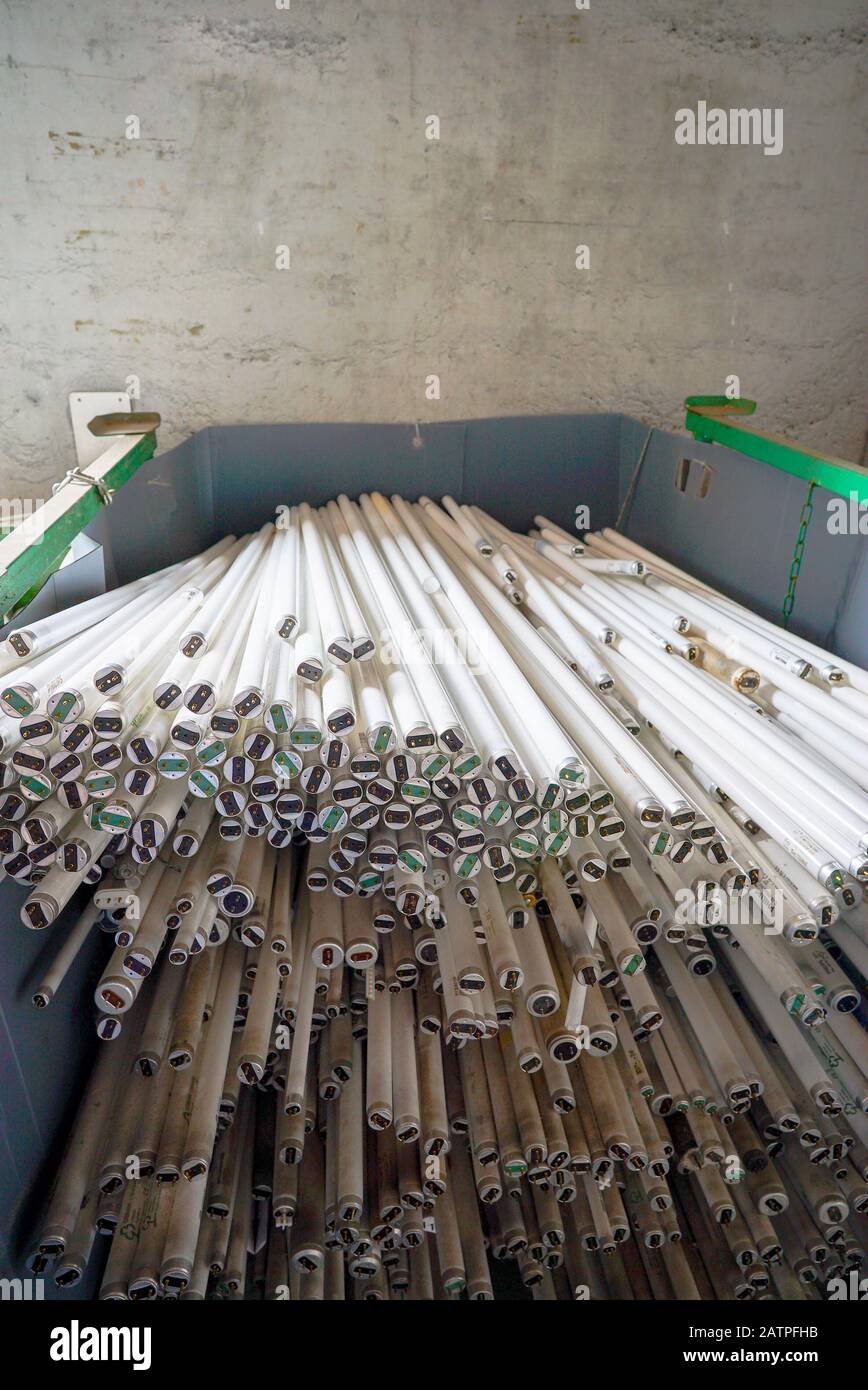 A selective focus view of large recycling bin filled with stacks of