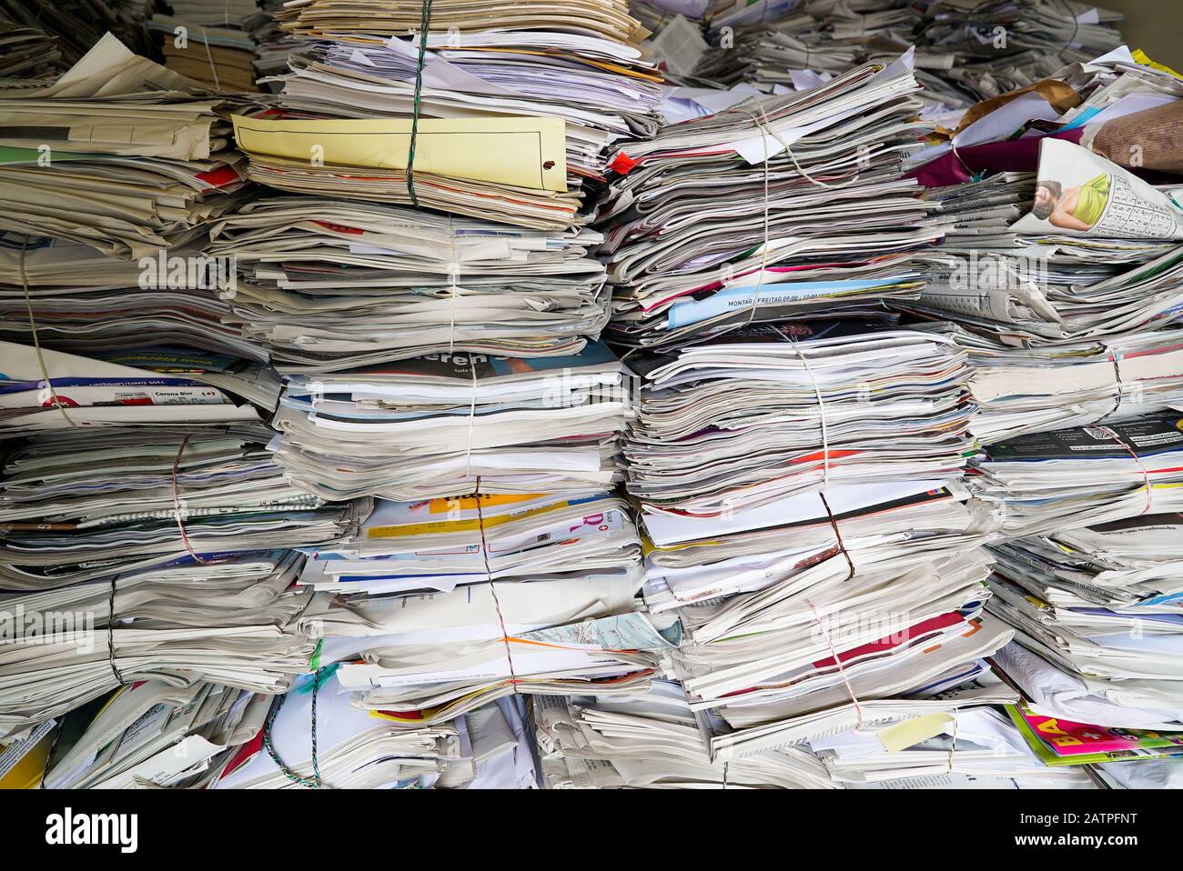 a-close-up-view-of-stacks-of-paper-and-magazines-and-newspapers-ready-to-be-recycled-2ATPFNT.jpg