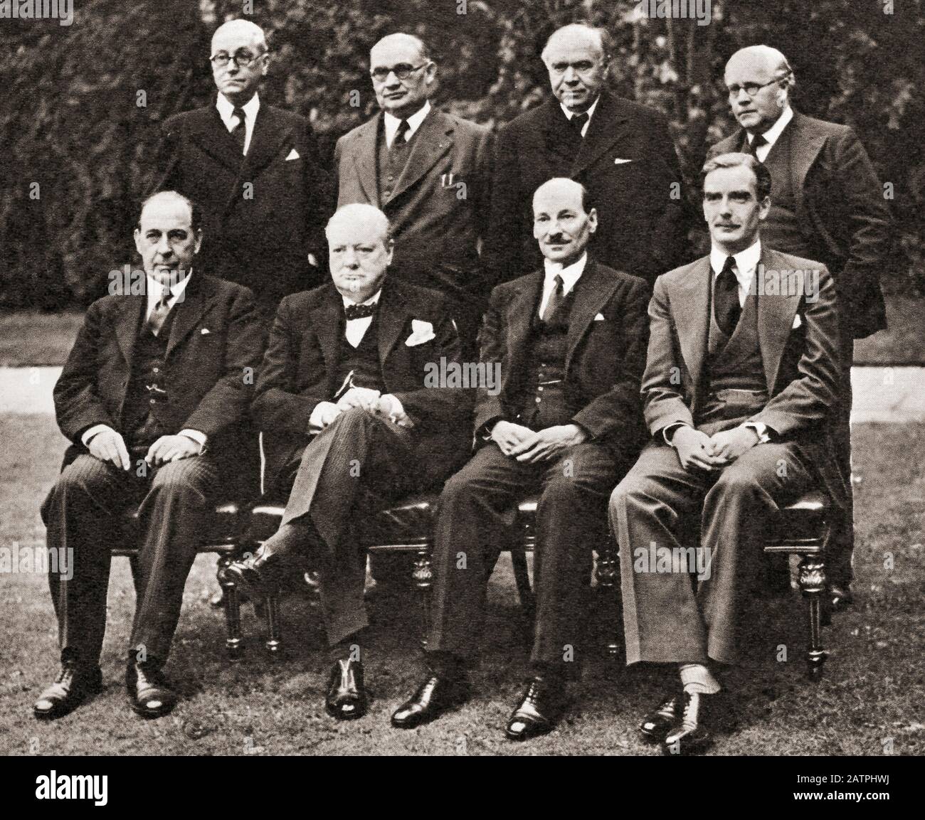 Mr. Churchill's War Cabinet in the spring of 1941. Back row, left to right, Mr. Arthur Greenwood, Minister without Portfolio, Mr. Ernest Bevin, Minister of Labour, Lord Beaverbrook, Minister of Aircraft Production, Sir Kingsley Wood, Chancellor of the Exchequer. Front row, left to right, Sir John Anderson, Lord President of the Council, Mr. Winston Churchill, Prime Minister, Mr. Clement Attlee, Lord Privy Seal, Mr. Anthony Eden, Foreign Secretary. Sir Winston Leonard Spencer-Churchill, 1874 –1965. British politician, statesman, army officer, and writer,  and Prime Minister Stock Photo