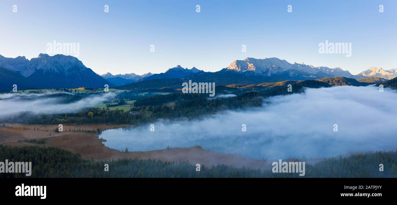Wafts of mist over Barmsee near Kruen, Karwendel and Wetterstein range, Werdenfelser Land, drone shot, Upper Bavaria, Bavaria, Germany Stock Photo