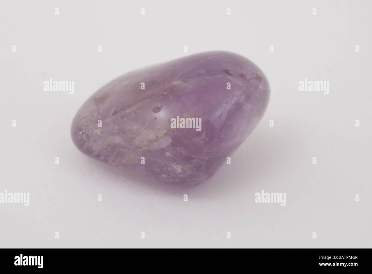 A Purple Amethyst healing gemstone Stock Photo