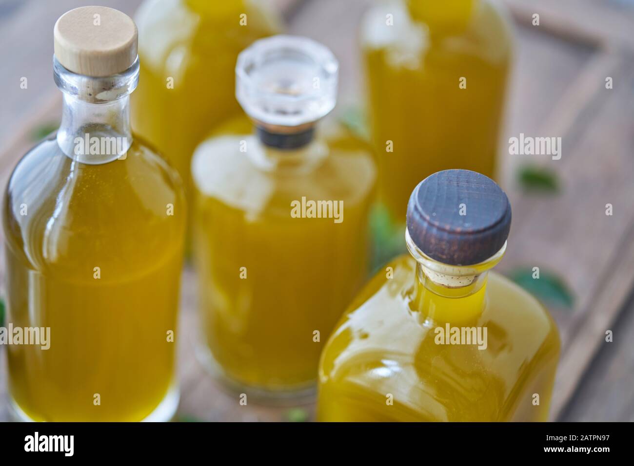 Blurred detail of bottles in a kitchen with different oils like olive or cooking oil for food. Natural and  organic healthy stylish Stock Photo