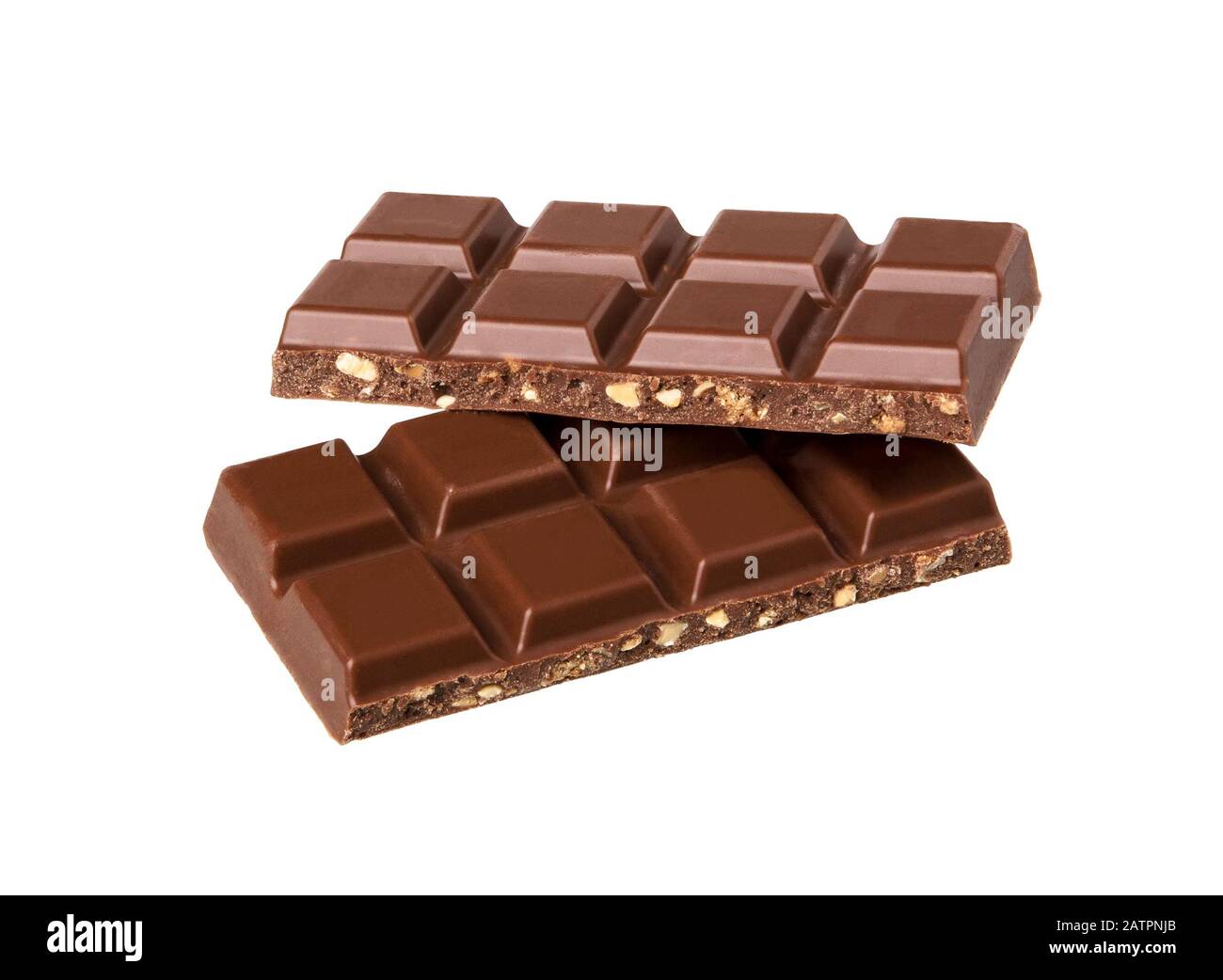 Milk chocolate pieces with nuts isolated on white background.  Chocolate bars lying on top of one another. Stock Photo