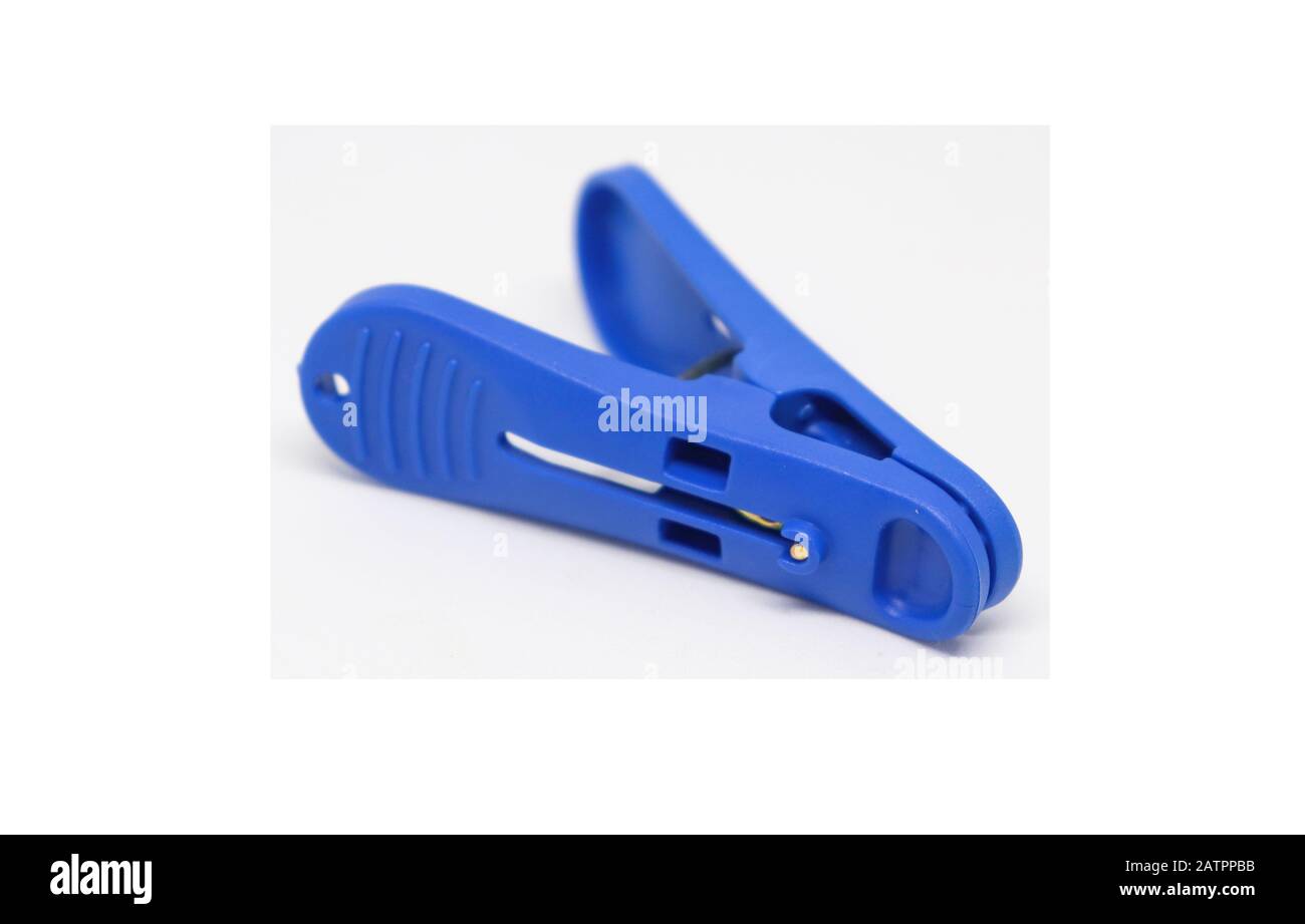 Blue plastic clothespins isolated on white background. Plastic clips