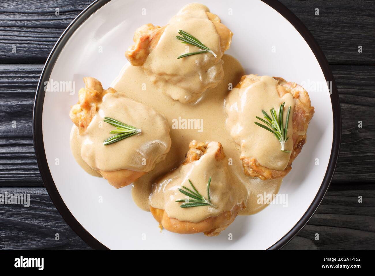 Baked Holy Yum Chicken thighs in spicy sauce from Dijon mustard and