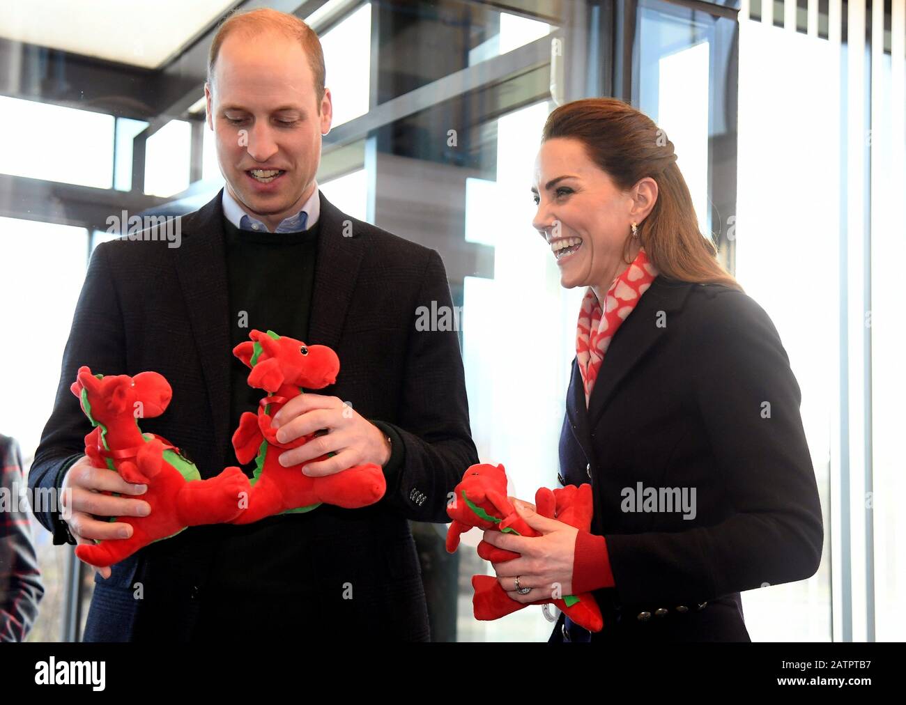 The Duke and Duchess of Cambridge, holding dragon toys they received for their children, during a visit to Tata Steel in Port Talbot in south Wales. Stock Photo