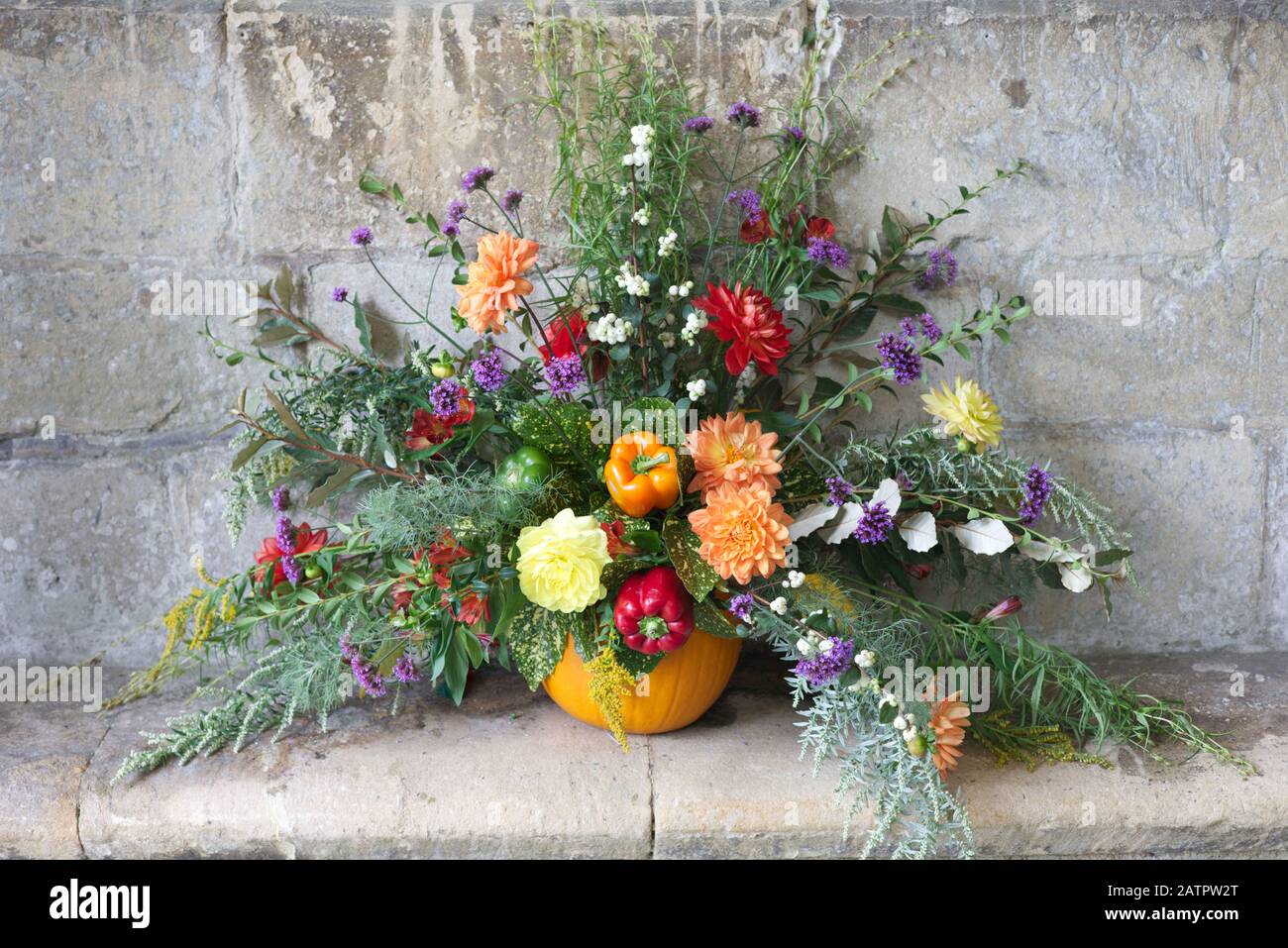 flower display for harvest festival in St Mary's church, Bibury, Gloucestershire Stock Photo
