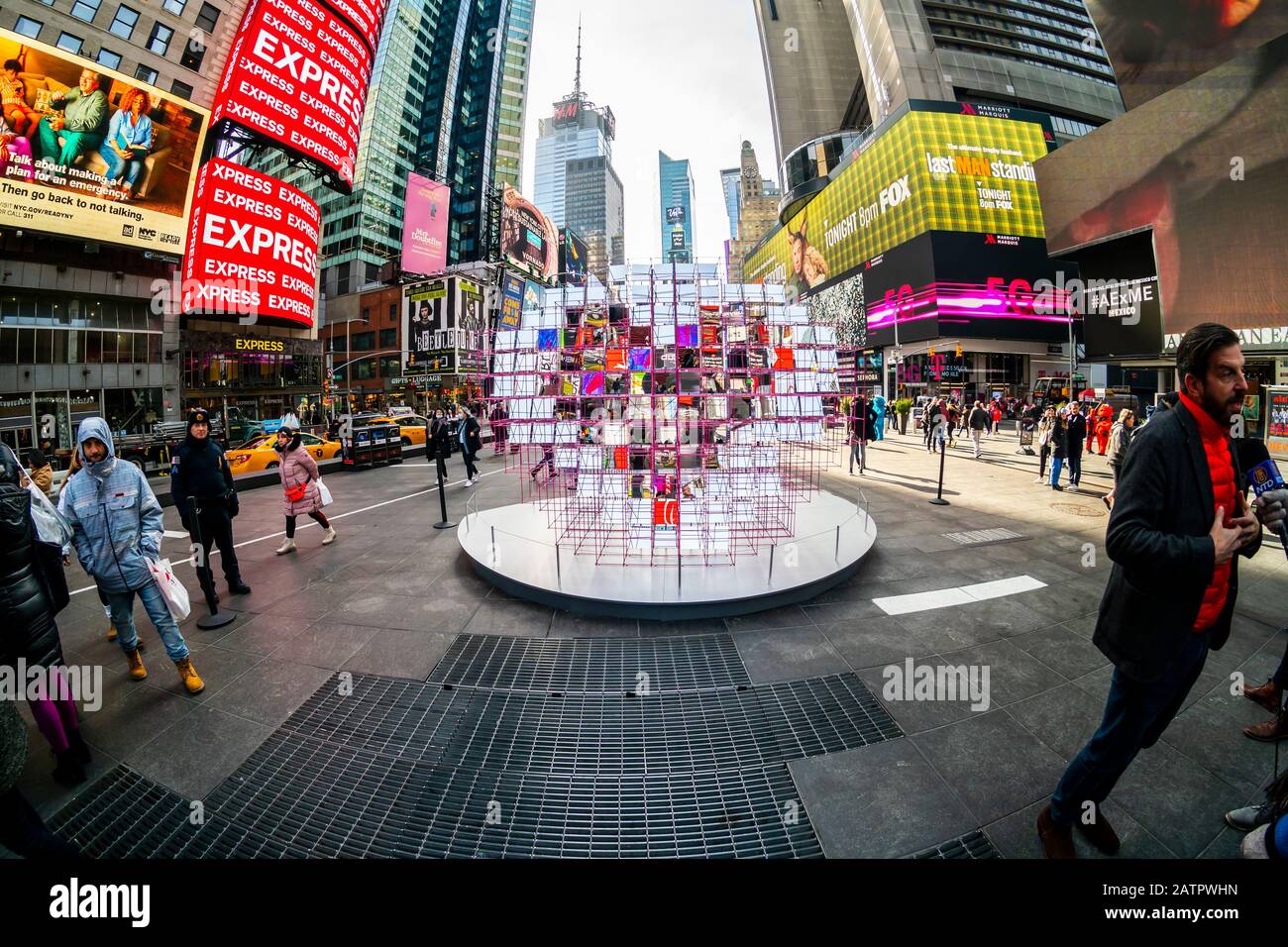 Tourists and the media crowd “Heart Squared”, the winner of the 12th Annual Times Square Valentine Heart Design in Times Square in New York, at its unveiling on Thursday, January 30, 2020. Created by MODU and Eric Forman Studios the sculpture consists of 125 mirrors precisely aligned to reveal a kaleidoscopic heart. The installation will be on view throughout February. (© Richard B. Levine) Stock Photo
