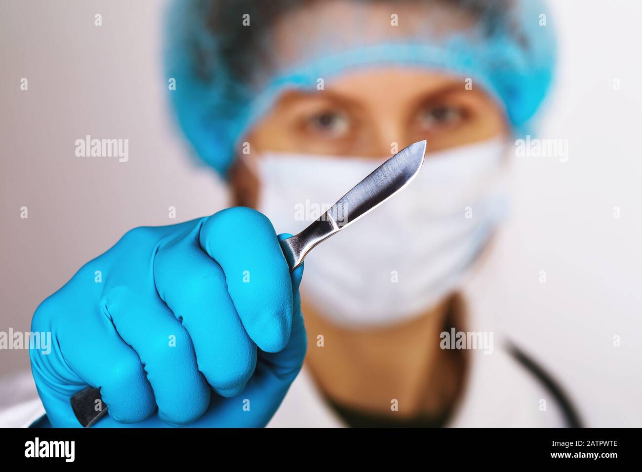 Doctor holds scalpel before surgery, closeup Stock Photo Alamy