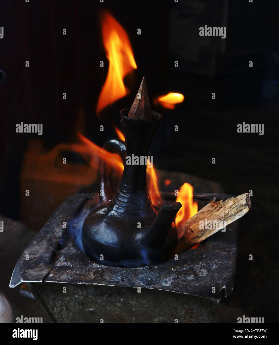 Lalibela/Ethiopia - April 2, 2019:  Traditional Ethiopian coffee pot on wood fire Stock Photo