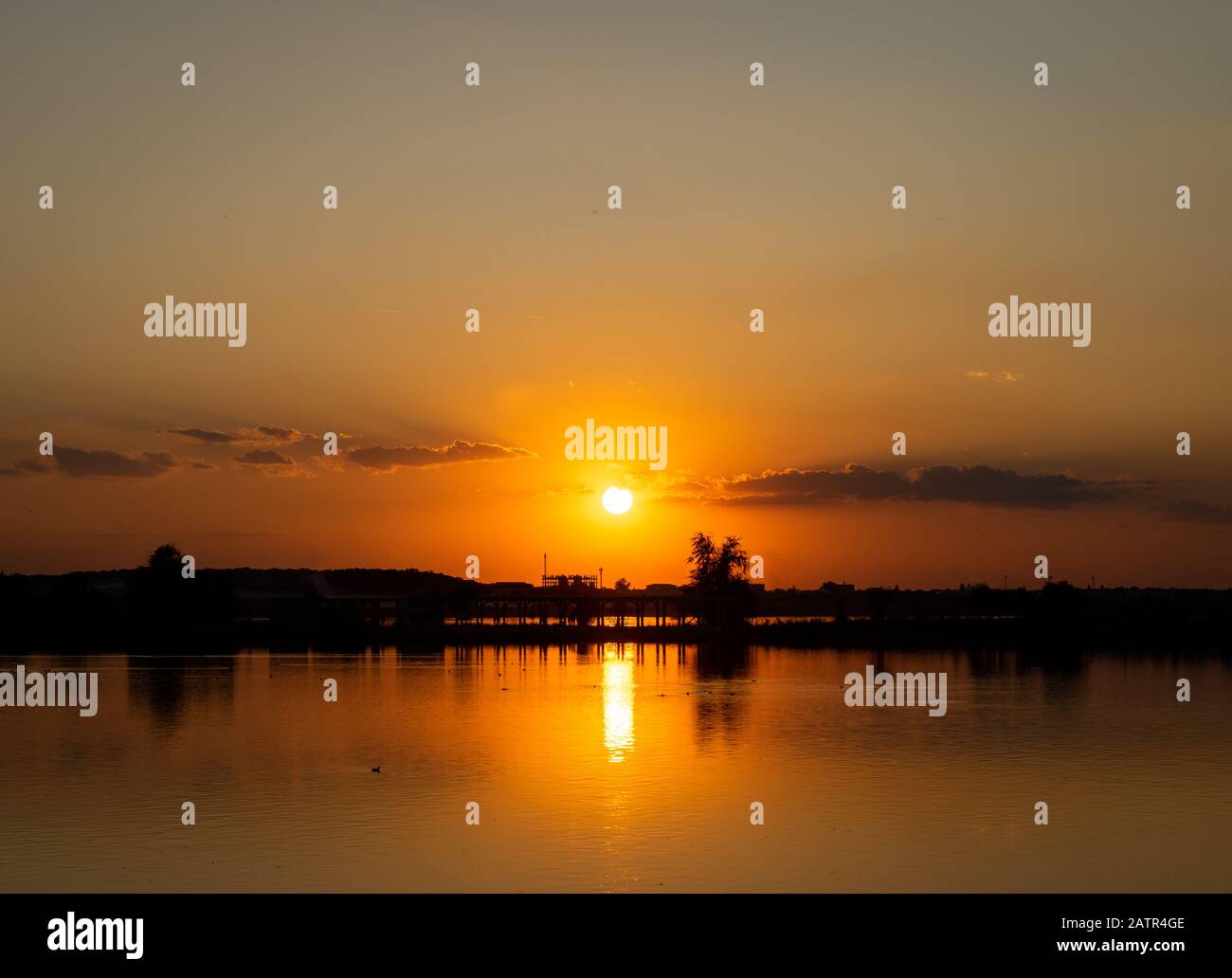 Lacul Morii, Bucharest, Romania - A beautiful sunset over the lake in high contrast. Stock Photo