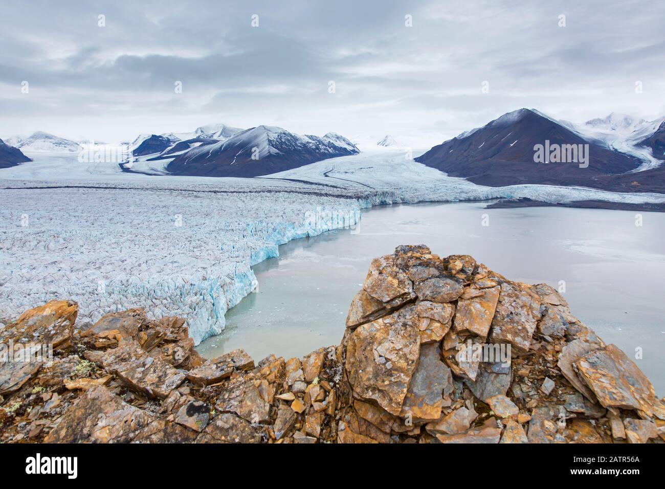 Osbornebreen and Vintervegen, merging glaciers in Oscar II Land debouches into St. Jonsfjorden at Spitsbergen / Svalbard, Norway Stock Photo