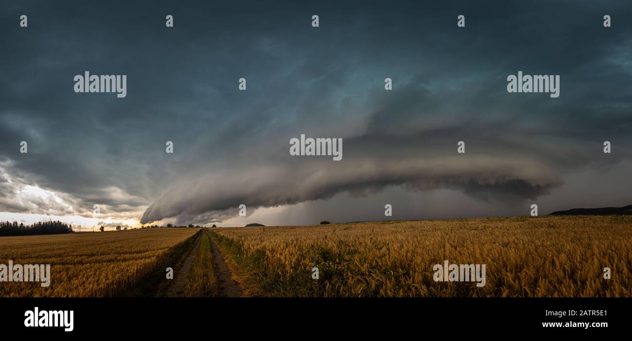 Beautiful supercell thunderstorm, daramtic clouds over the field Stock Photo