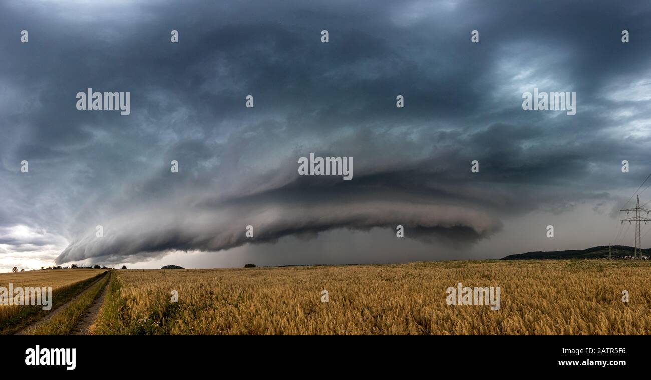 Beautiful supercell thunderstorm, daramtic clouds over the field Stock Photo