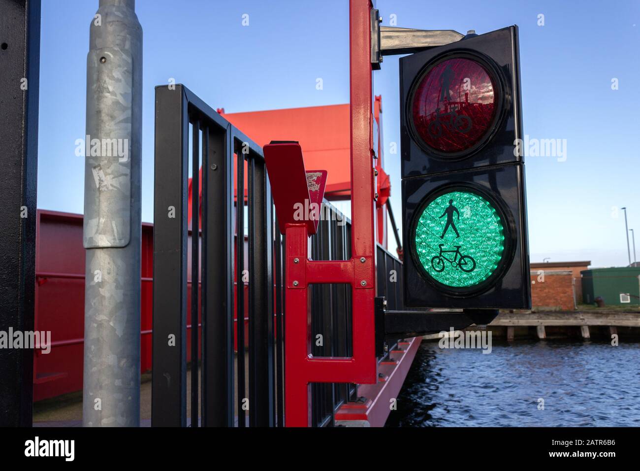 Green pedestrian and cyclist traffic light, bascule bridge, Four Bridges, Birkenhead Stock Photo