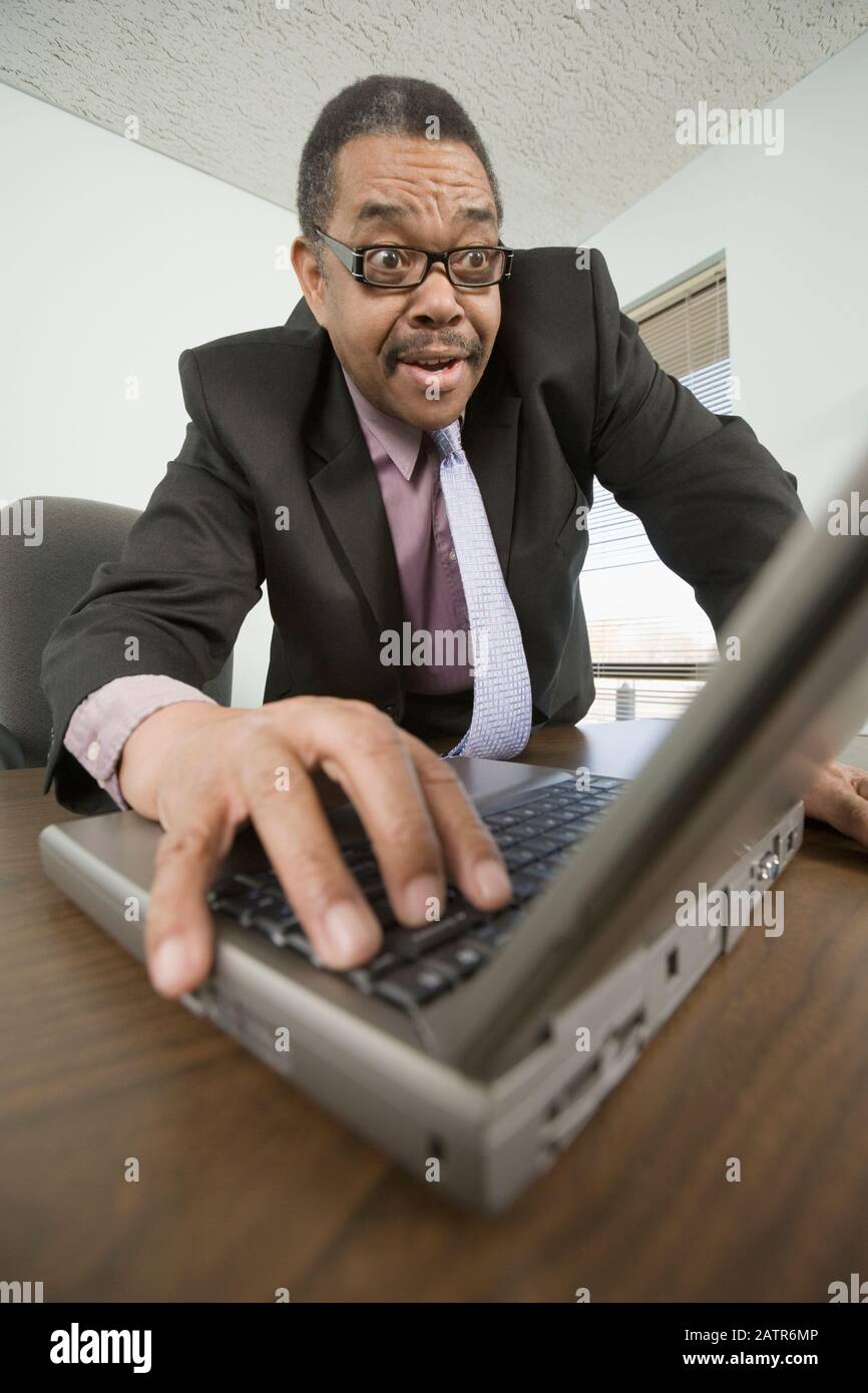 Businessman working on a laptop Stock Photo