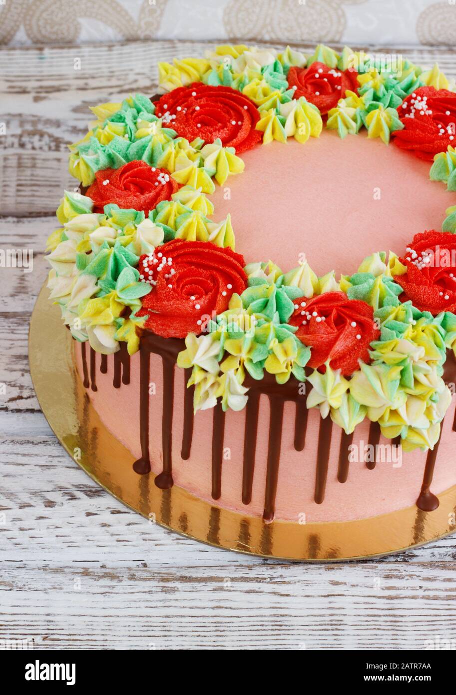 Birthday cake with flowers rose on white background Stock Photo - Alamy