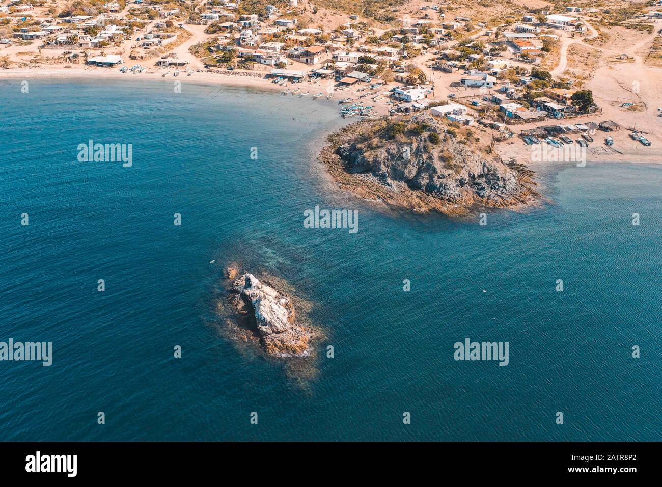 Islets, island in Choyudo beach. stable land area full of guano. Islet is a small island: Cayo, Faralló Islette, Isle, sea water, surrounded, body of water, aera view, vista aera, turquoise, green, blue, color turquesa, color verde, color azul .  islotes, isla en playa el Choyudo. zona terrestre estable plagada de guano. islote es una pequeña isla: cayo, faralló islette, isle ,  agua de mar, rodeada, masa de agua,  (Photo:LuisGutierrez) Stock Photo