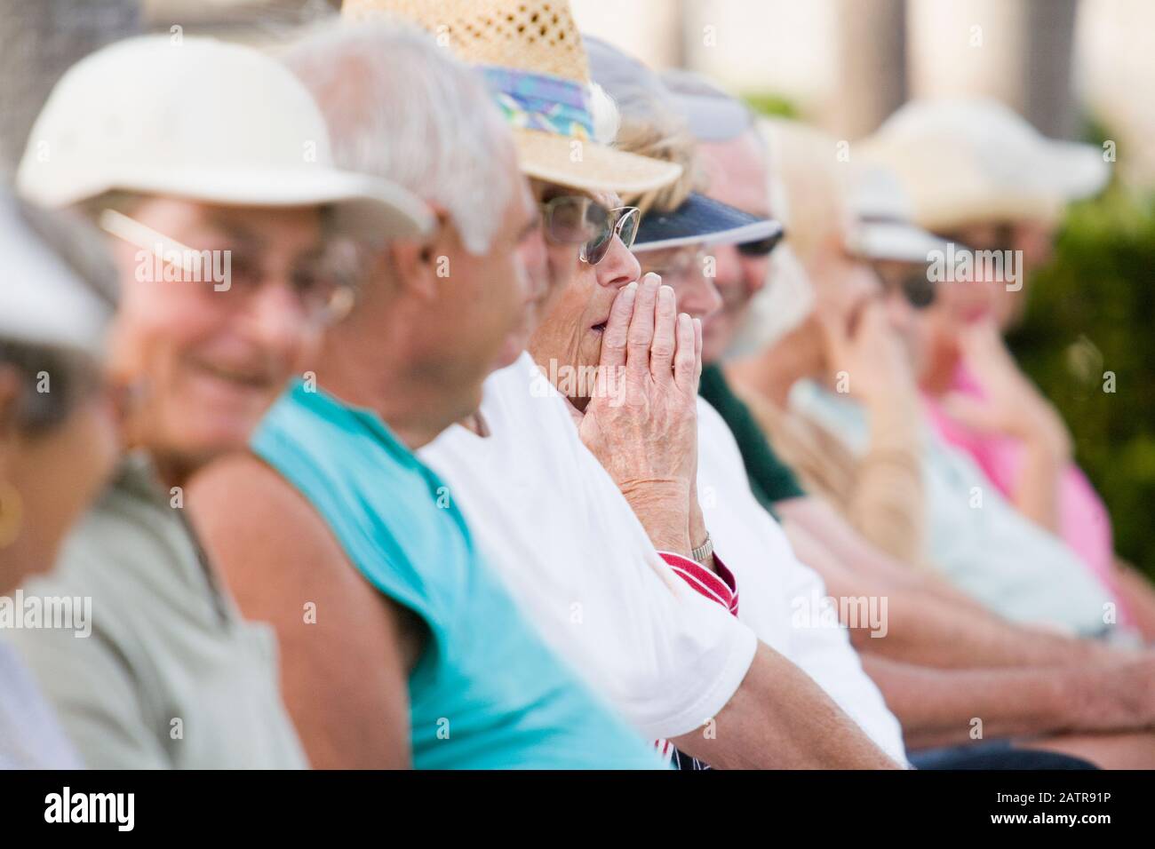 Group of senior people sitting in a row Stock Photo - Alamy