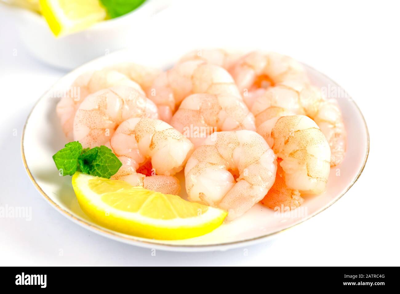 king prawns close up cooked and peeled on a white background Stock