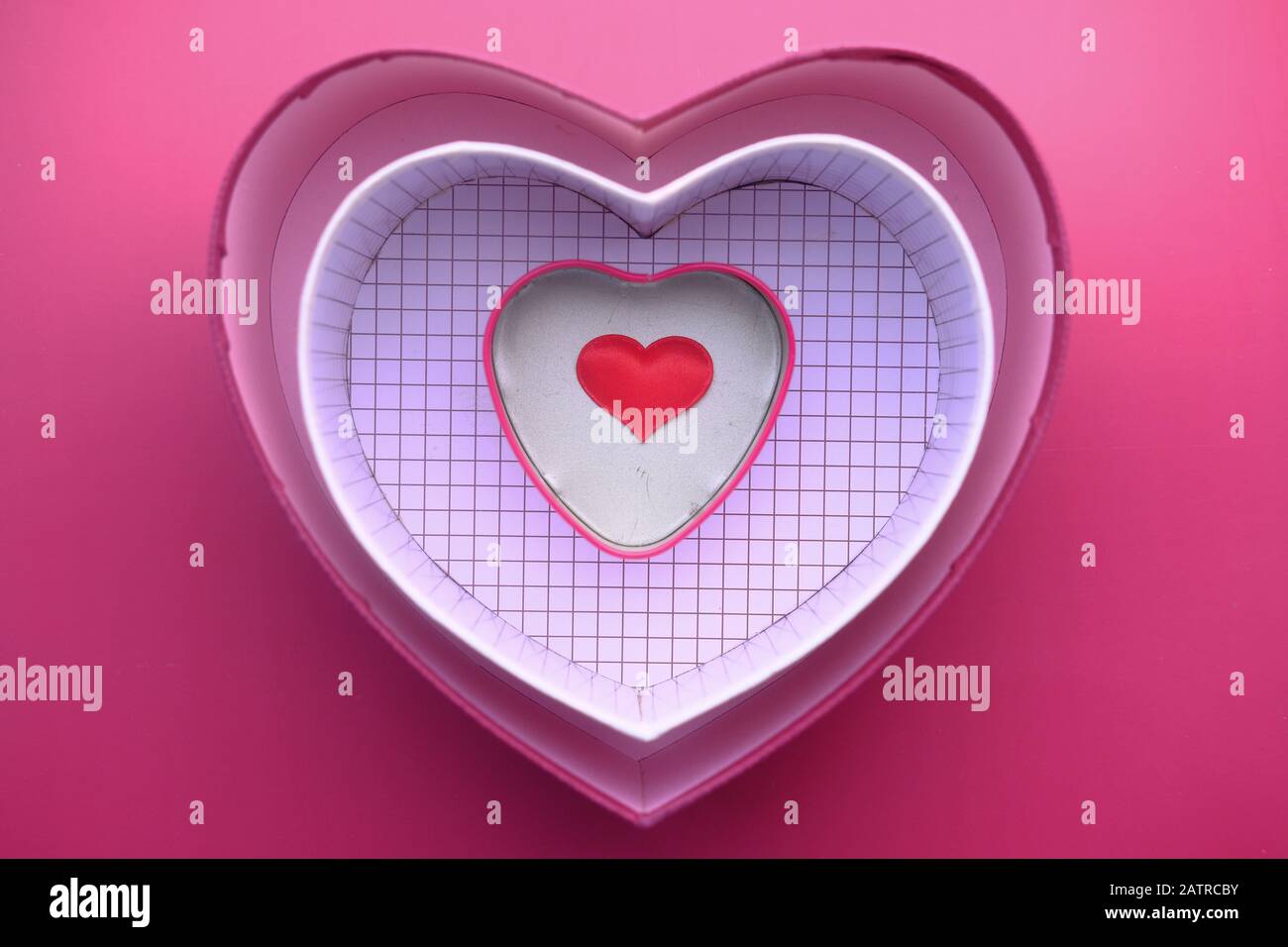 top view of heart shape gift box on red background Stock Photo
