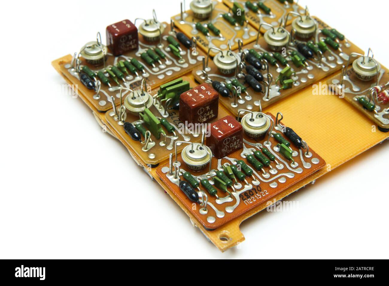 The old vintage circuit board with several electronic components Stock