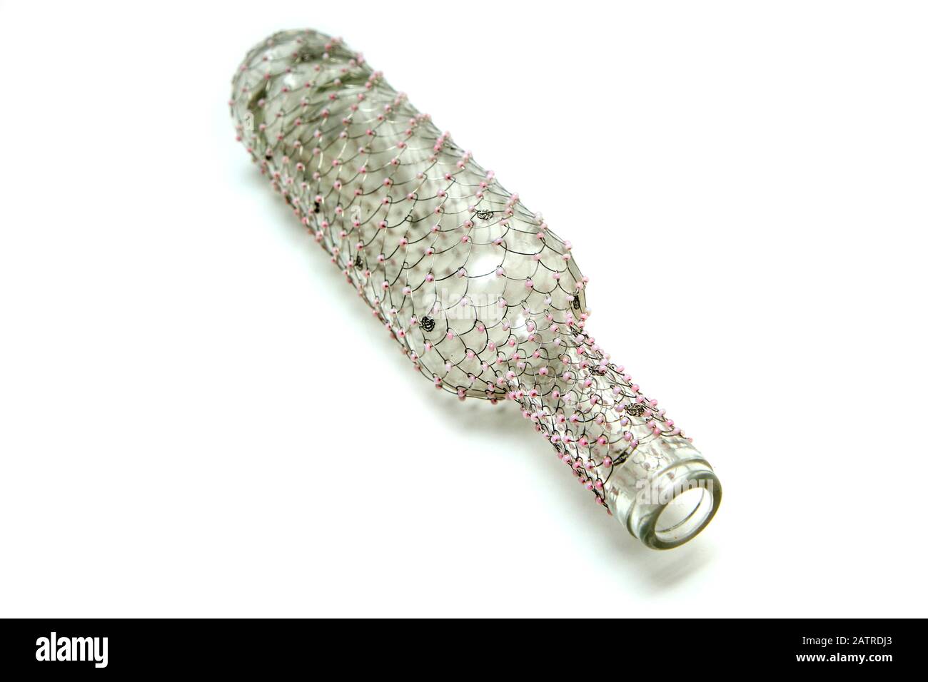 The wire brushed wine bottle. The traditional decorative craft. In a