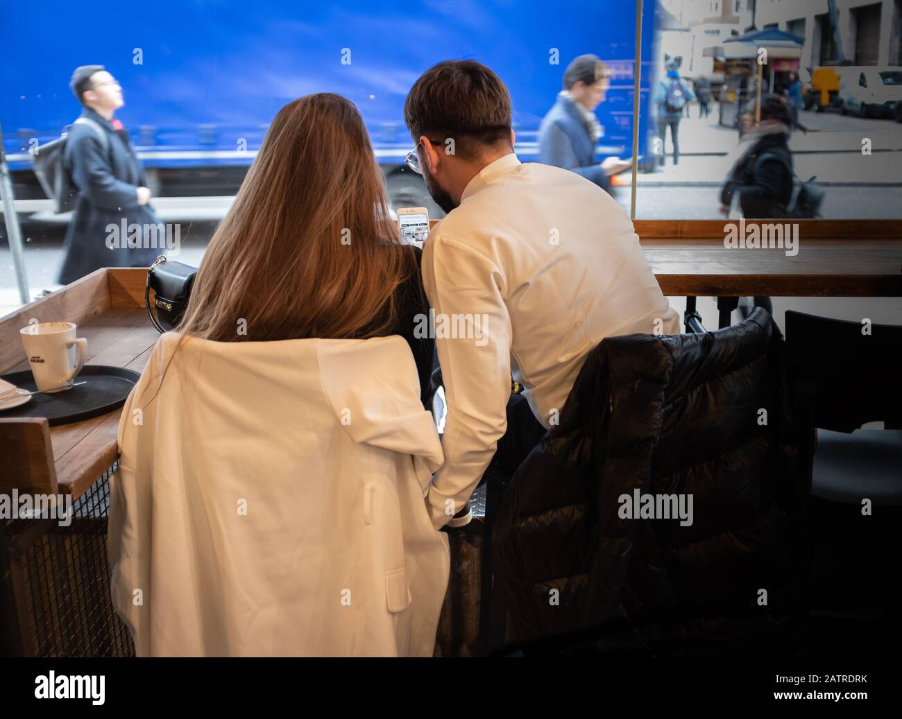 young couple being affectionate in coffee shop Stock Photo
