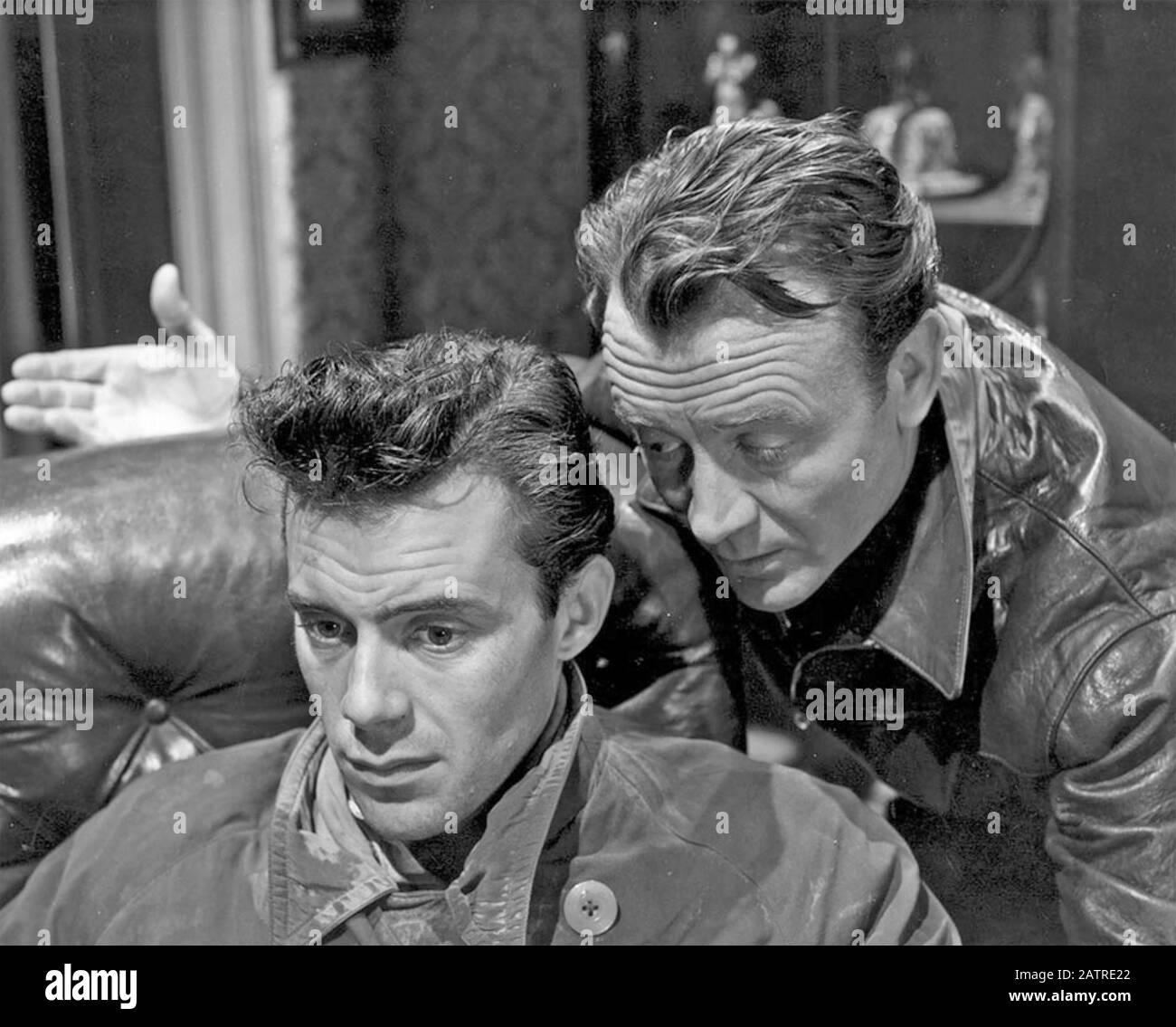 THE GENTLE GUNMAN 1952 Universal International film with John Mills at right and Dirk Bogarde Stock Photo