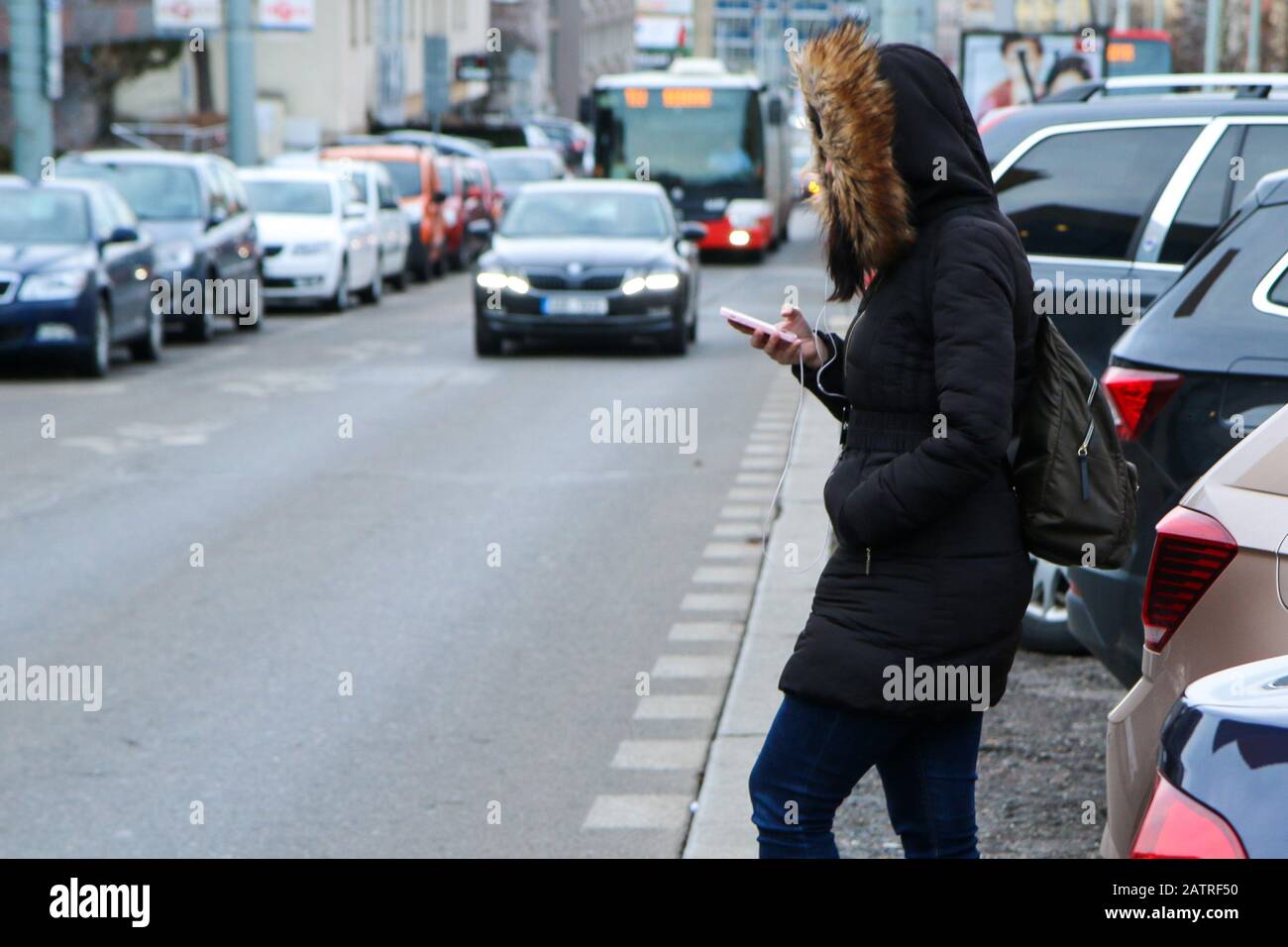 Illustration of the problem of the modern age. Called digital zombie. People are watching their smart phone with headphones and don´t pay attention Stock Photo