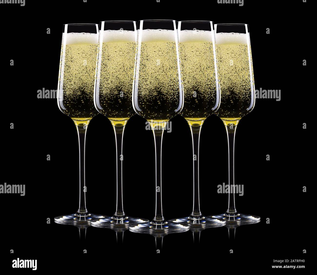 Set of luxury champagne glasses in a row isolated on a black background