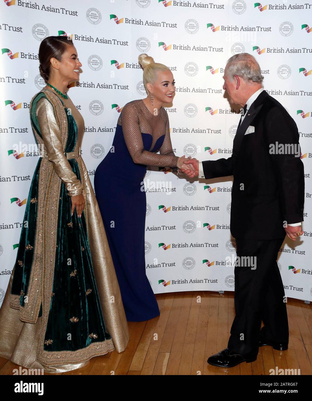 The Prince of Wales meets Indian businesswoman Natasha Poonawalla (left) and musician Katy Perry (centre left), as he attends a reception with the Duchess of Cornwall for supporters of the British Asian Trust at Banqueting House, Whitehall, London. Stock Photo