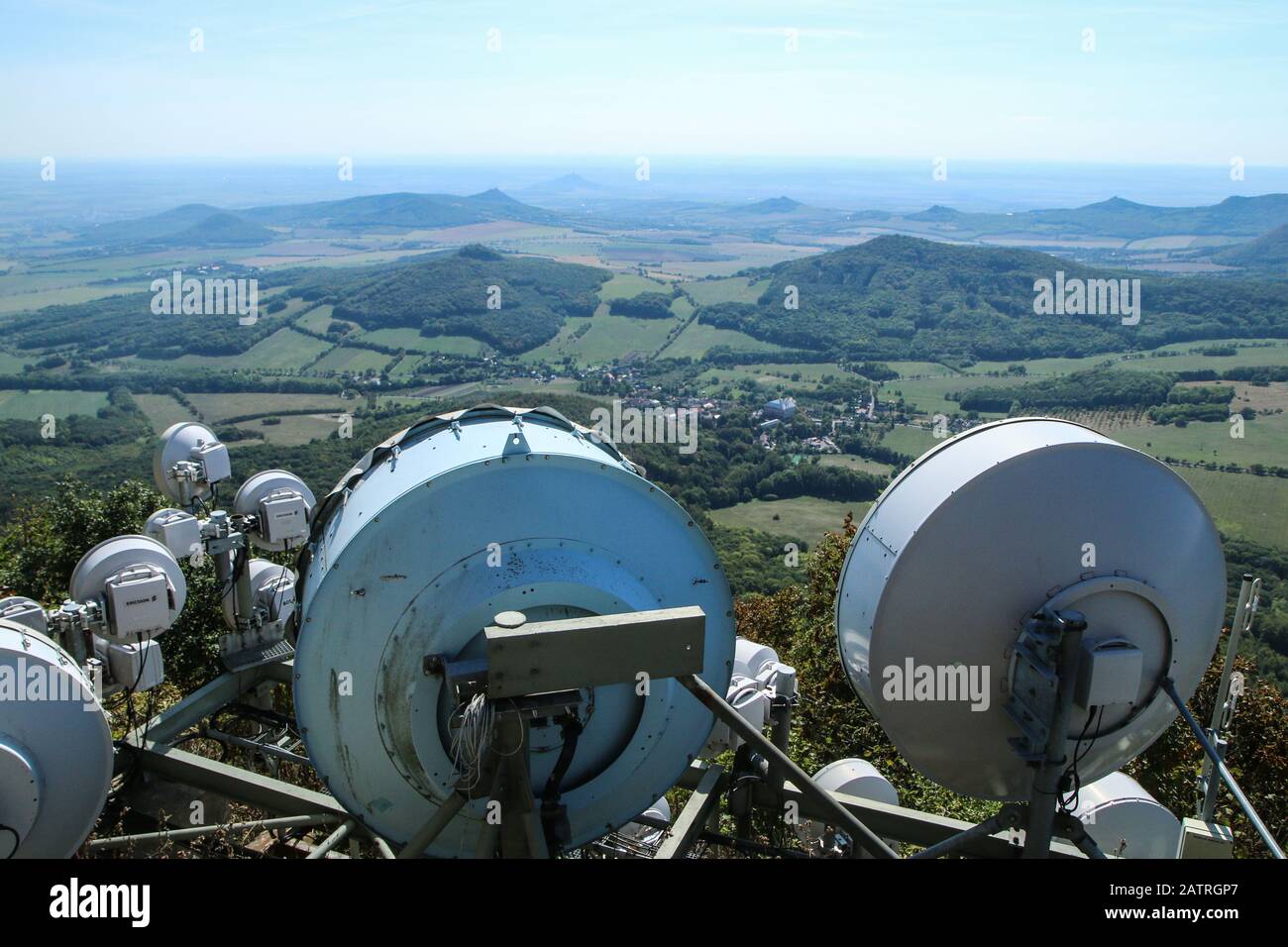 The telecommunication antennas on the high hill covering the whole land  with the internet, radio or TV signal Stock Photo - Alamy
