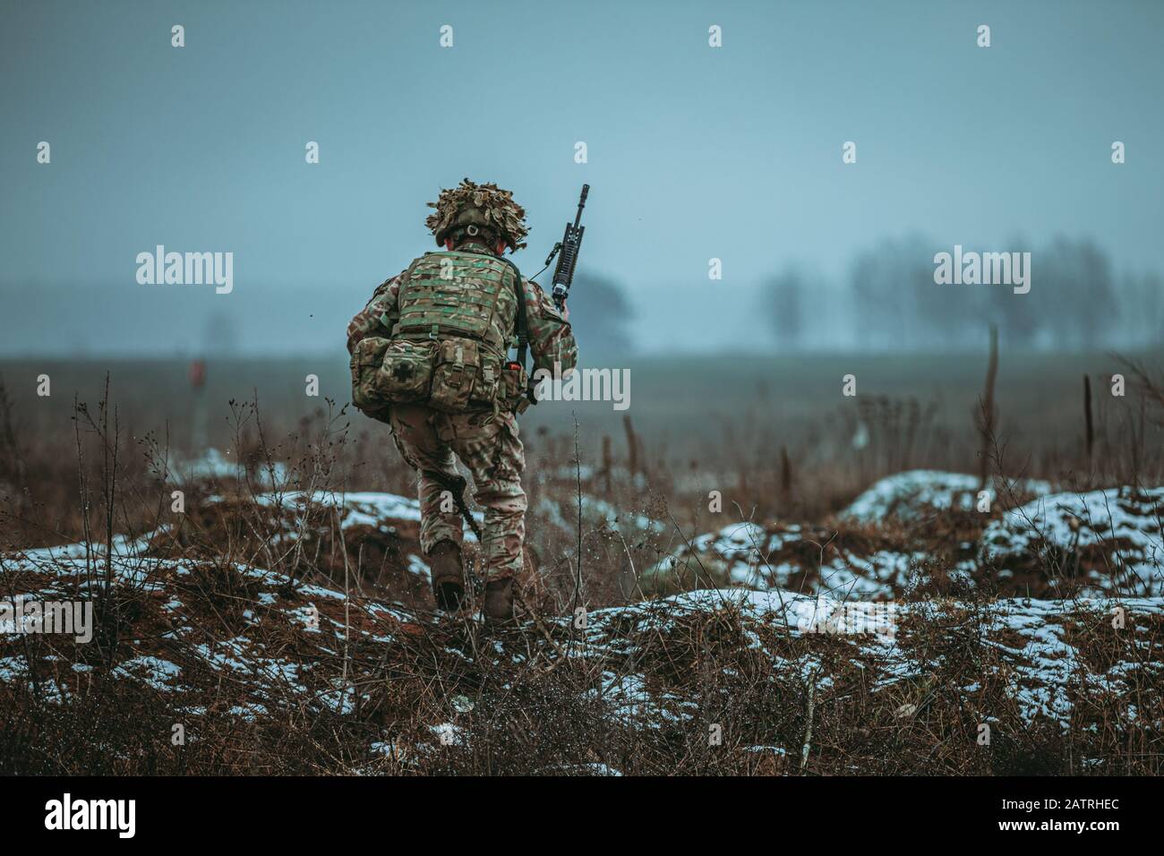 Bemowo Piskie, Poland. 04th Feb, 2020. A British Soldier, assigned to the Royal Scots Dragoon Guards, runs for cover during a NATO live-fire exercise February 4, 2020 in Bemowo Piskie, Poland. Credit: Sgt. Timothy Hamlin/Planetpix/Alamy Live News Credit: Planetpix/Alamy Live News Stock Photo