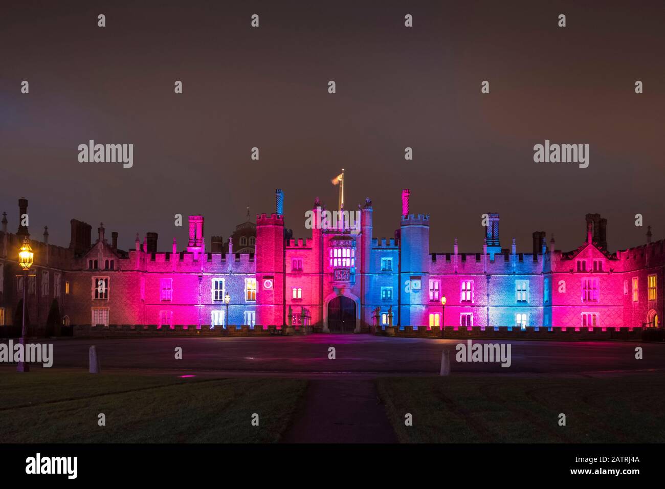 Hampton Court Palace with glowing Christmas lights; London, England Stock Photo