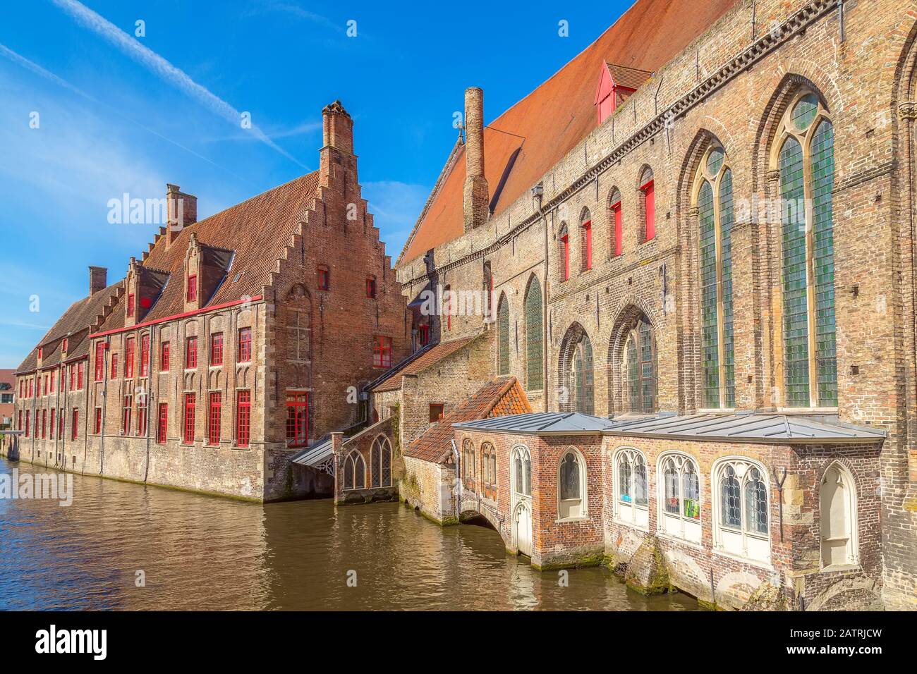 Bruges, Belgium hospital of St. John or Sint-Janshospitaal and canal in the old town of Brugge Stock Photo