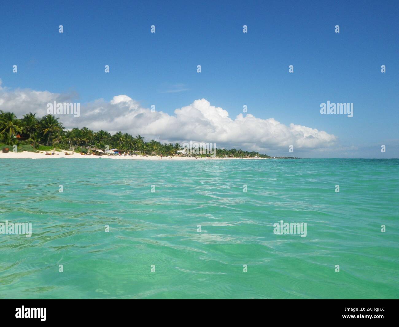 The Beach at Tulum as seen from the turquoise water, Tulum, Quintana Roo, Mexico on a beautiful sunny day. Stock Photo