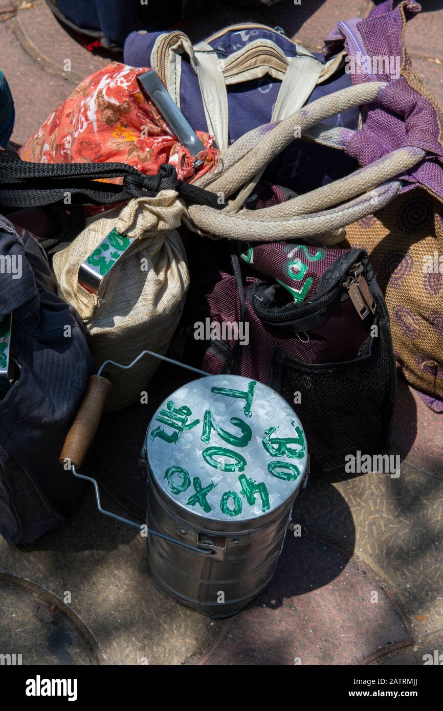 India, Mumbai aka Bombay. Dabbawalas (aka dabbawallas or dabbawallahs, tiffin wallahs) deliver lunches all over the city every day. Detail of lunches. Stock Photo