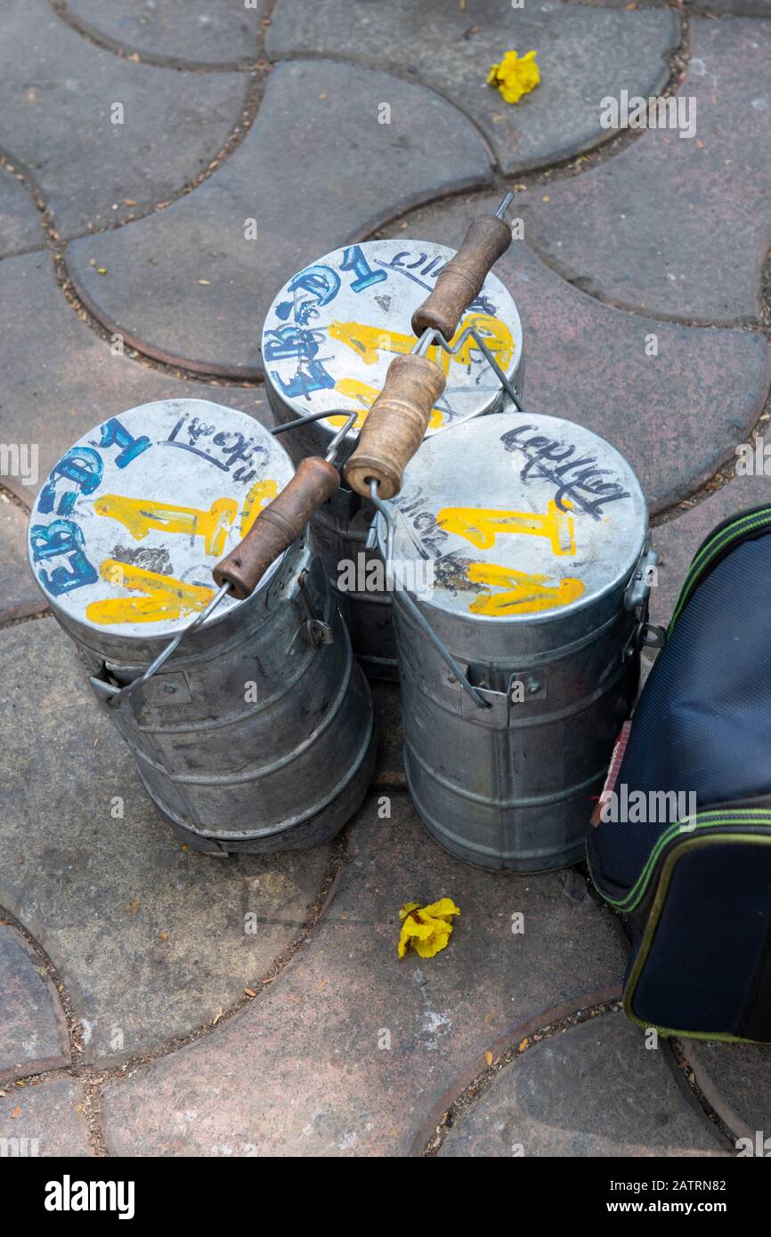 India, Mumbai aka Bombay. Dabbawalas (aka dabbawallas or dabbawallahs, tiffin wallahs) deliver lunches all over the city every day. Detail of lunches. Stock Photo
