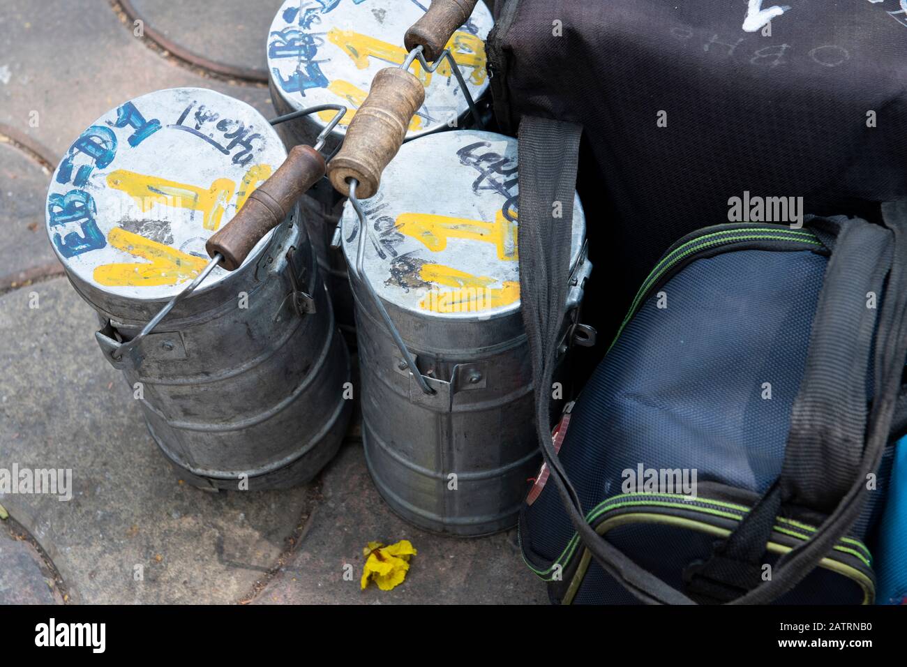 India, Mumbai aka Bombay. Dabbawalas (aka dabbawallas or dabbawallahs, tiffin wallahs) deliver lunches all over the city every day. Detail of lunches. Stock Photo