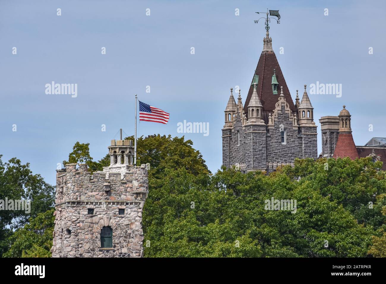 Detail of Boldt castle towers in Heart Island. Located in the border between Canada and United States. An United States flag on the top. Thousands Isl Stock Photo