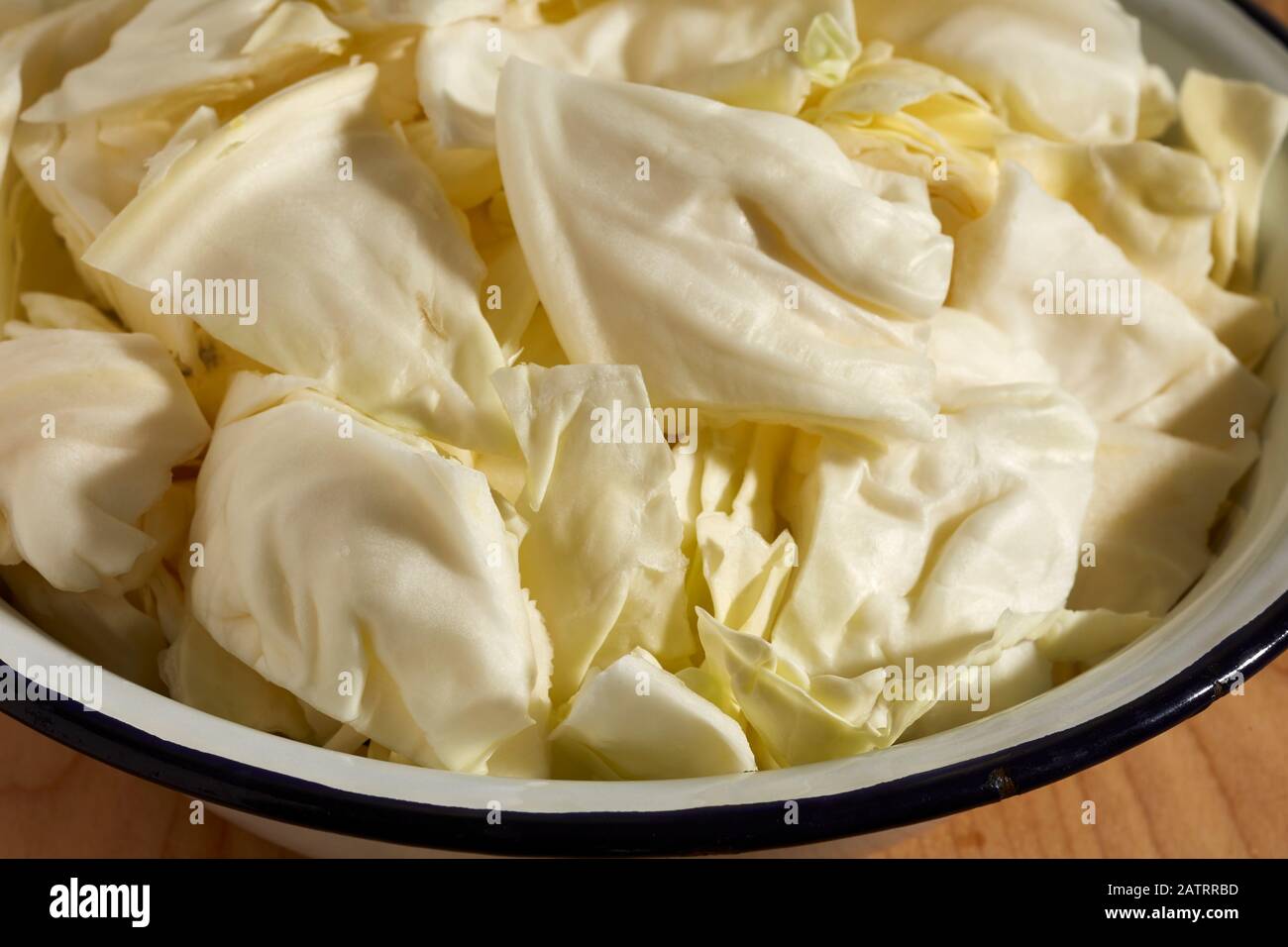 A bowl of chopped pieces of green cabbage Stock Photo