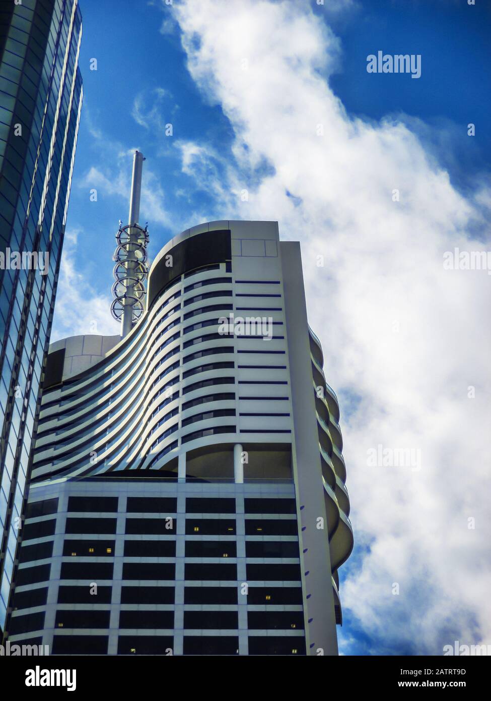 6-18-2014 Brisbane Australia Space Age looking very modern high rise buildings against dramatic blue sky with clouds Stock Photo