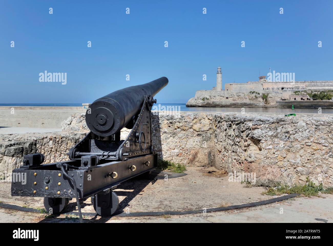 Cannon, Castillo de San Salvador de la Punta, Castillo del Morro (background); Central; Havana, Cuba Stock Photo