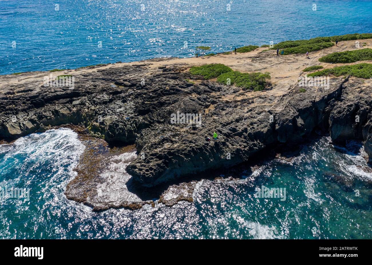 Coastline off La'ie Point on Oahu, Hawaii with sea angler on the headland Stock Photo