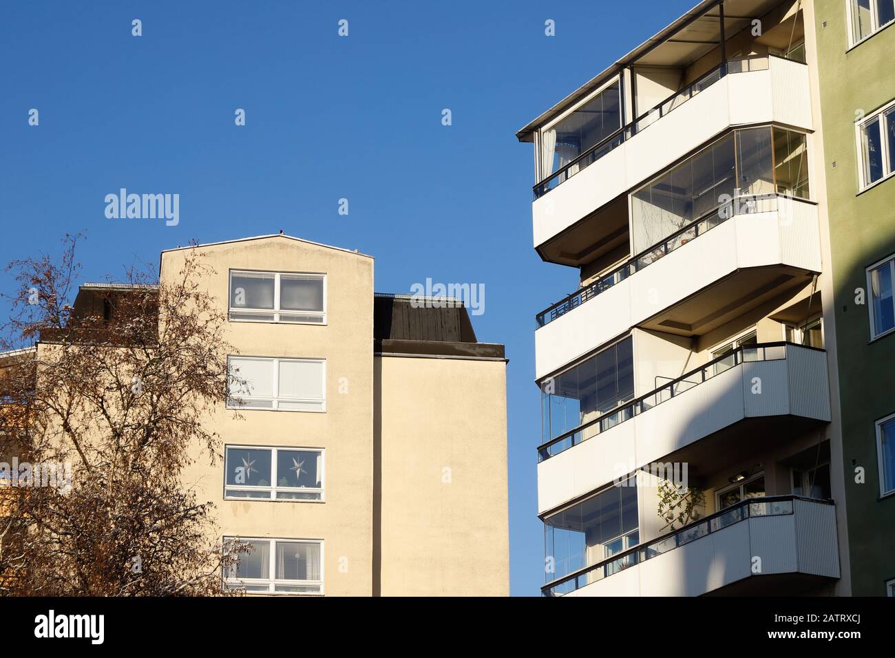 View of two residential multi story buildings constructed during 1950s and 1960s era. Stock Photo