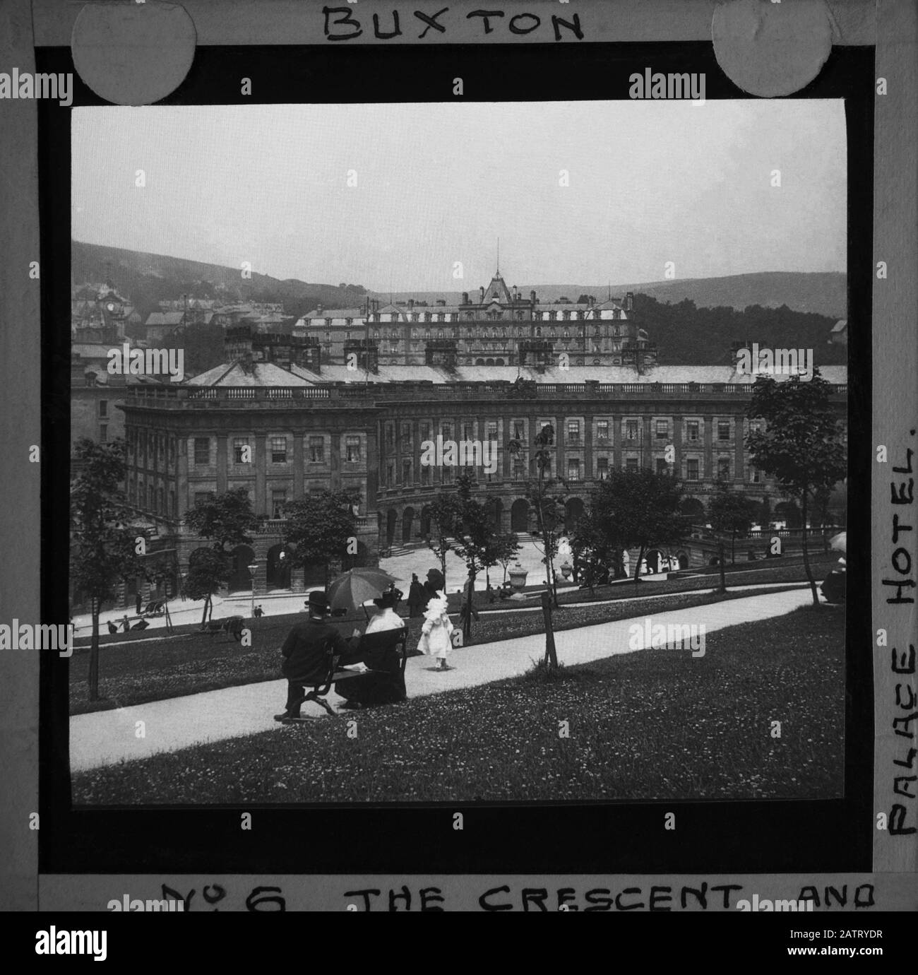 Buxton Crescent & Thermal Spa Hotel & Palace Hotel during the Victorian period c1890, Victorians in front of the Bath House, antique old glass magic lantern slide picture. The newly renovated hotel is due to open in 2020 creating a northern capital for health and wellbeing. Antique Magic Lantern Slide.  Original photographer unknown, copyright period expired.  Digital photography, restoration, editing copyright © Doug Blane. Stock Photo