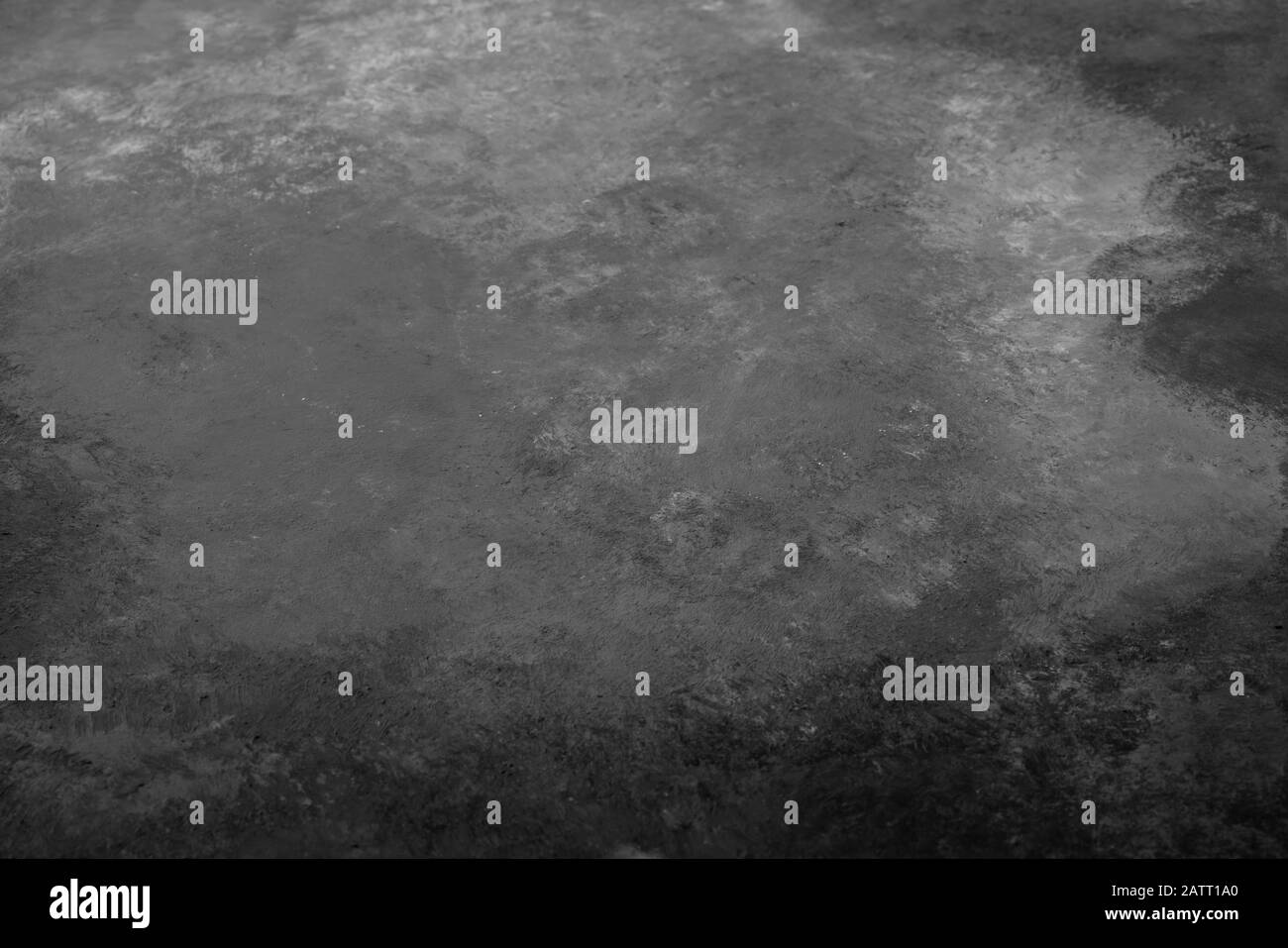 black and white painted textured wall as a background with copy space ...